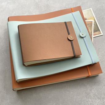 Three sizes of recycled leather photo albums made in England by Undercover
